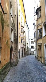 Narrow alley amidst buildings in town