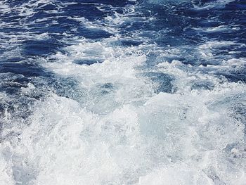 High angle view of waves splashing on shore