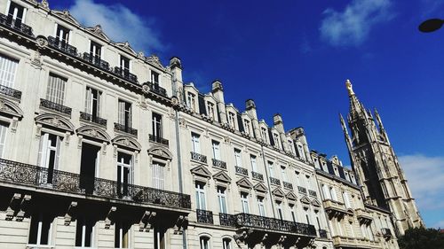 Low angle view of building against blue sky