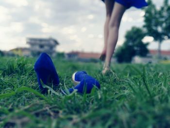 Person standing on grassy field