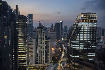 High angle view of buildings in city at night