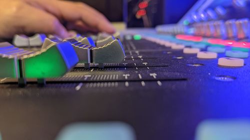 Cropped hand of man using laptop