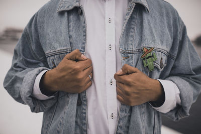 Midsection of man holding gift