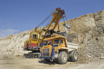 Earth mover working at quarry