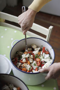 Close-up of woman preparing pickle at home