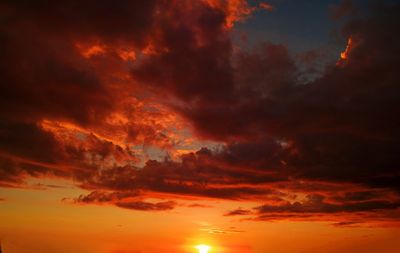 Low angle view of dramatic sky during sunset