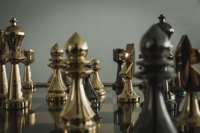 Close-up of chess pieces on table