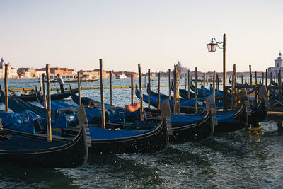 Boats moored in canal