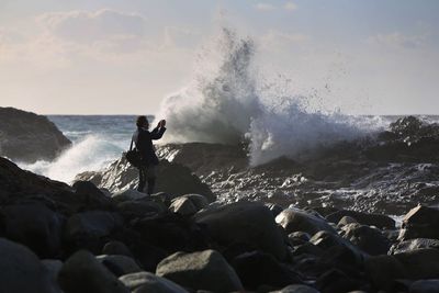 Man looking at sea waves