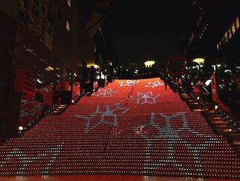 Illuminated red lights at night