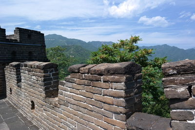 View of old ruin building against cloudy sky