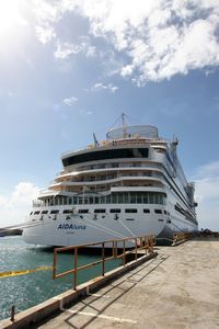 View of commercial dock against cloudy sky