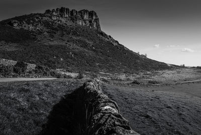 Low angle view of rock formations against sky