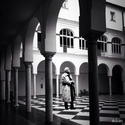 Full length of woman standing in corridor