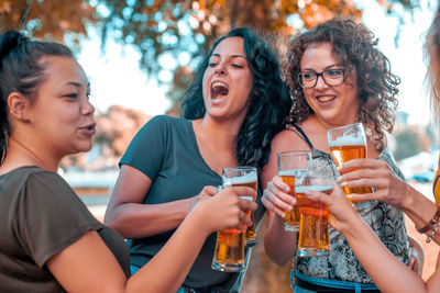 Happy women doing celebratory toast