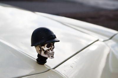 High angle view of human skull on car hood