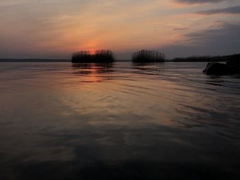 Scenic view of sea against sky at sunset