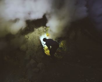 Man working in sulphur mines at ijen