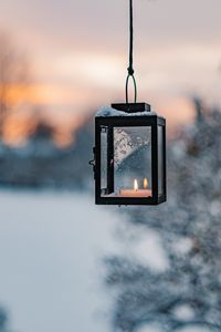 Close-up of illuminated light against sky