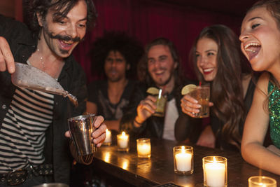 Bartender serving drinks at a nightclub