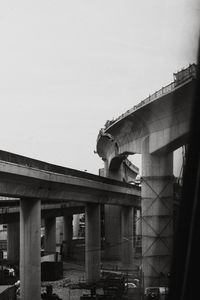 Low angle view of old bridge against building