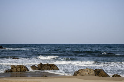 Scenic view of sea against clear sky