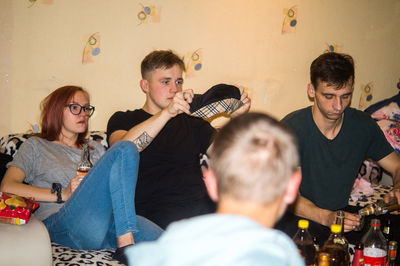 Group of people sitting in room