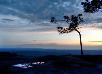 Scenic view of landscape against sky at sunset