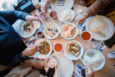 High angle view of people on table