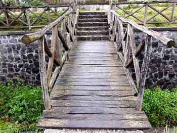 Empty footbridge along footpath