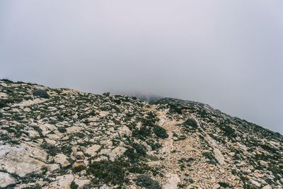 Scenic view of rocky mountains against clear sky