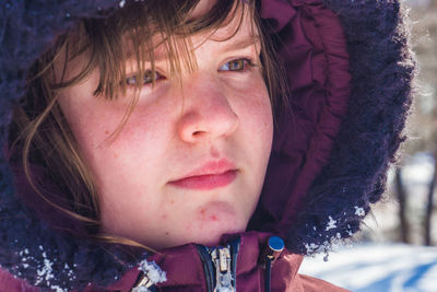 Close-up portrait of girl in winter