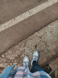 Low section of women standing on street