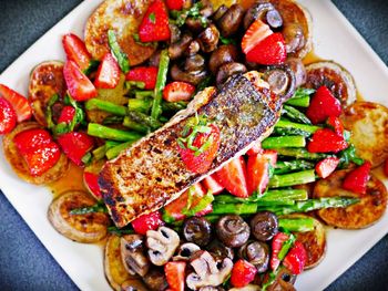 High angle view of strawberries in plate on table