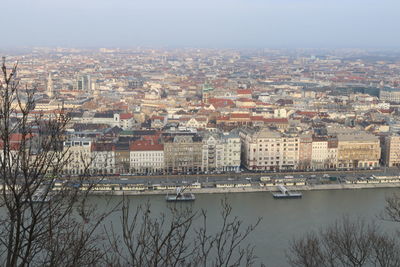 High angle view of river amidst buildings in city