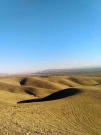 Scenic view of landscape against clear blue sky