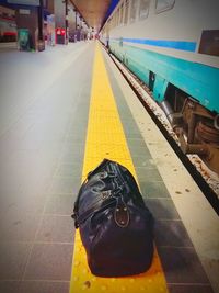 Person with yellow umbrella in city