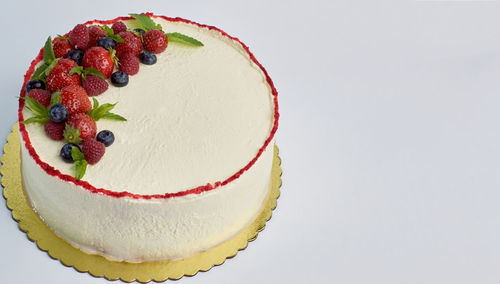 Close-up of cake against white background