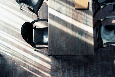 High angle view of table and chairs at restaurant