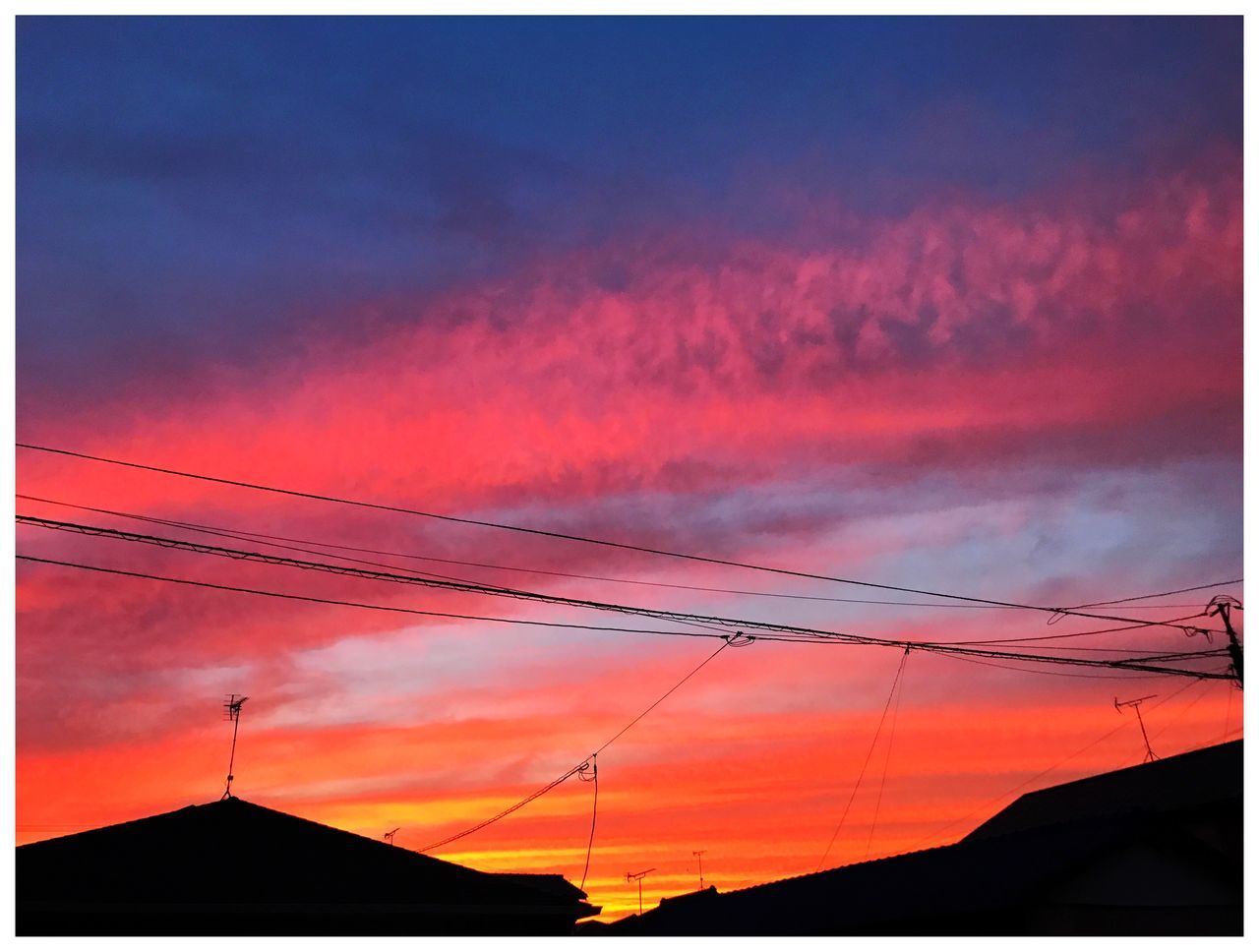 silhouette, sunset, connection, orange color, cable, no people, sky, outdoors, low angle view, beauty in nature, nature, built structure, electricity pylon, scenics, technology, building exterior, architecture, vapor trail, day