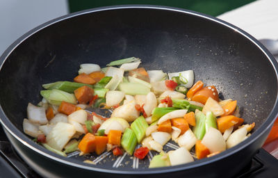 Close-up of sliced vegetables in frying pan