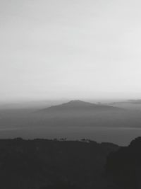 Scenic view of silhouette mountains against sky