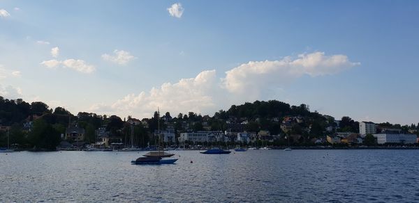 Panoramic view of sea and buildings against sky