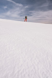 Full length of person skiing on snow land