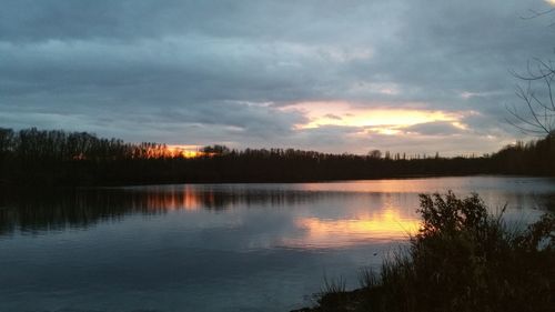 Scenic view of lake against sky during sunset