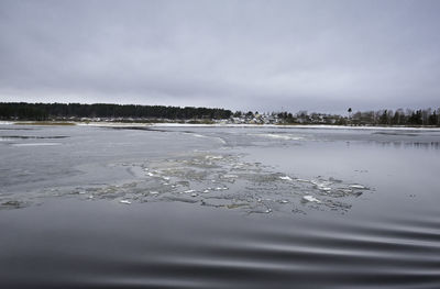 Scenic view of frozen lake against sky