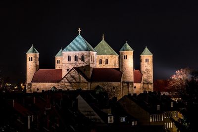 Illuminated cathedral against sky at night