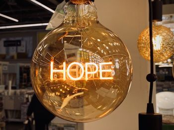 Close-up of illuminated light bulb