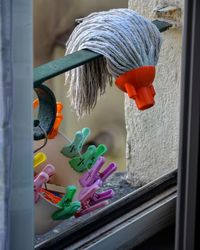 Close-up of multi colored toy on window