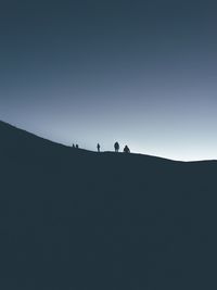 Silhouette of mountain against clear sky